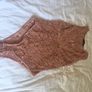 Nude lace body suit